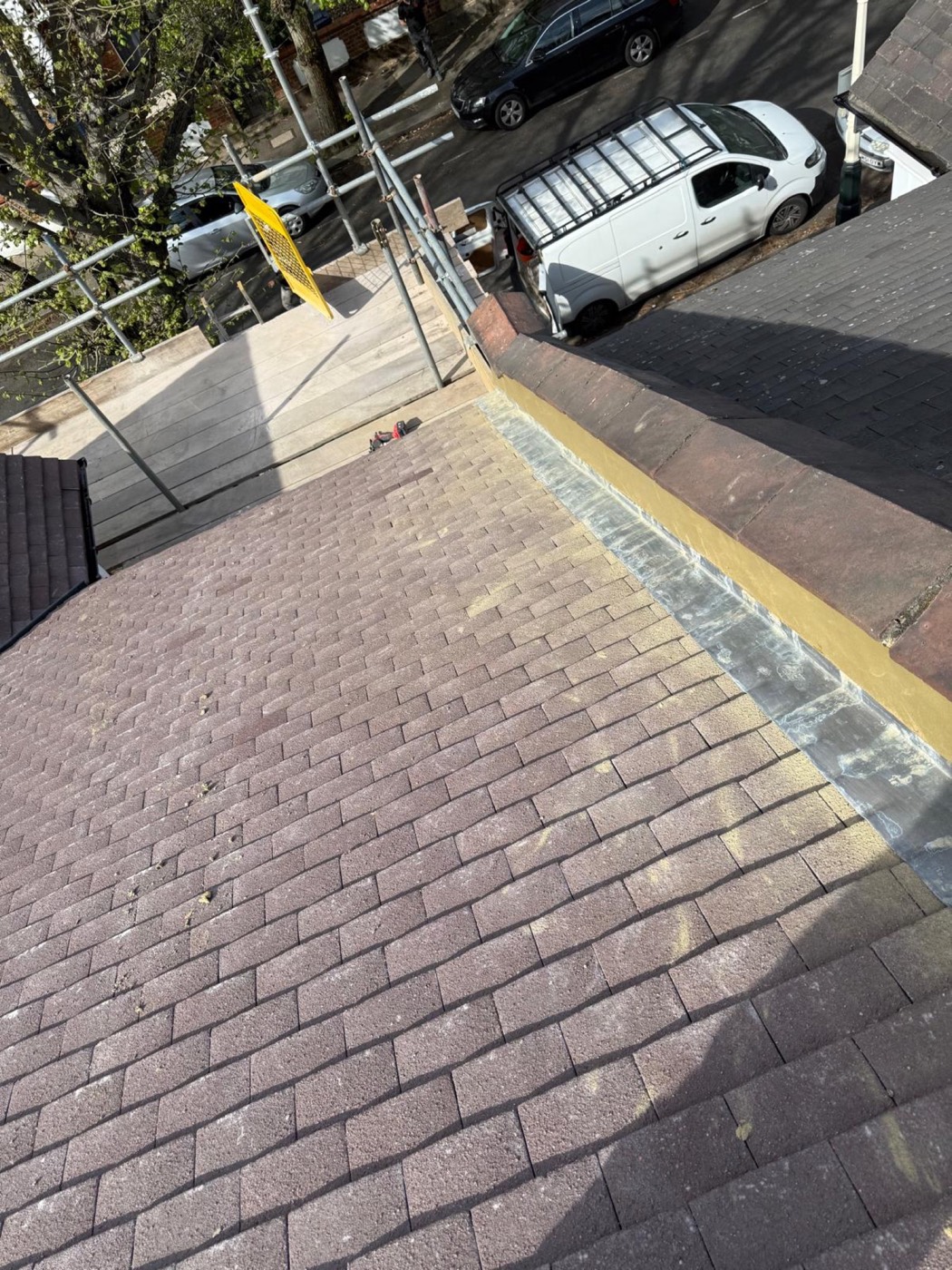 A wide lead secret gutter and mortar fillet against the neighbouring parapet