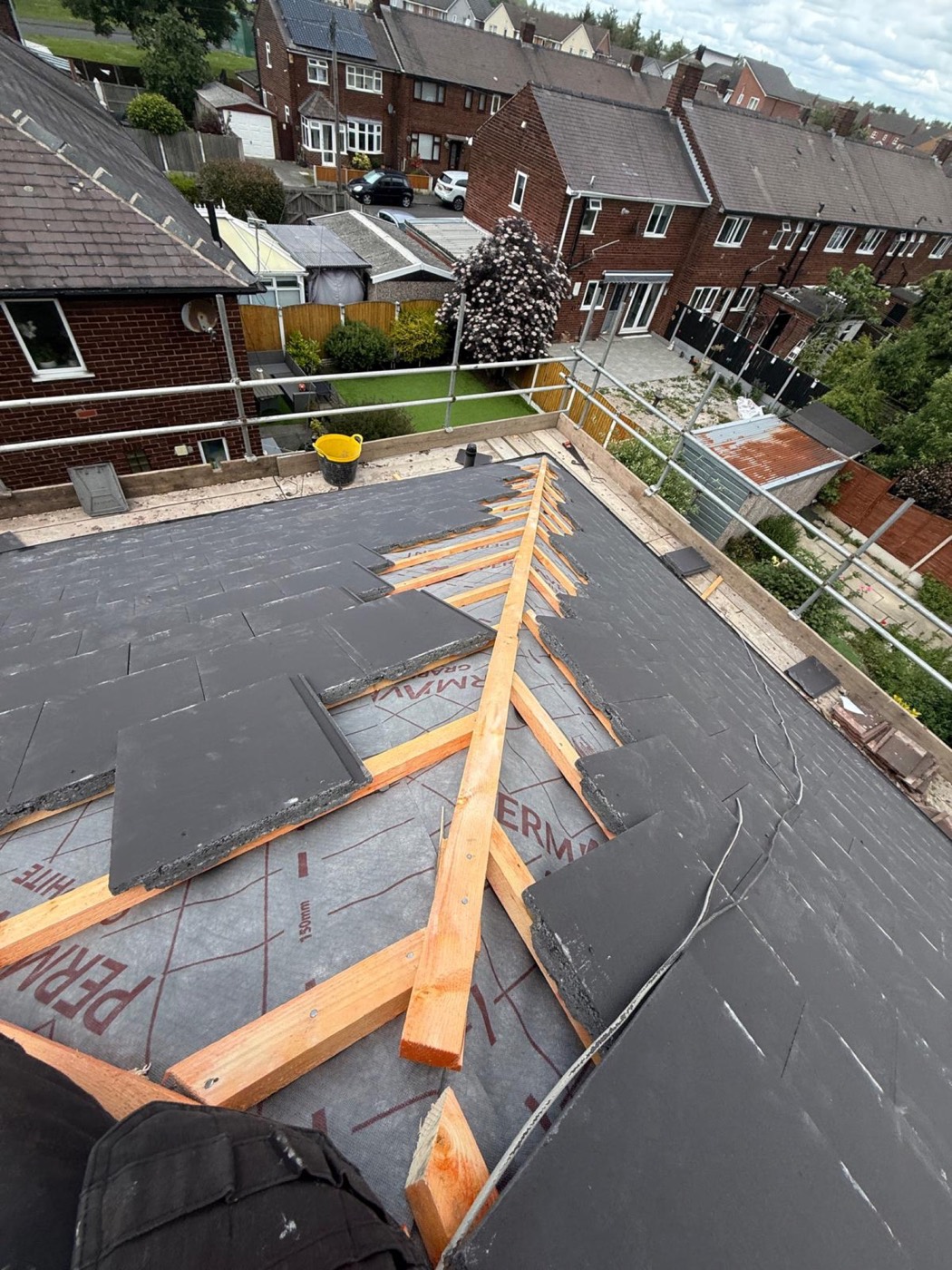 New roof going on: breather membrane and battens down, slates stacked ready